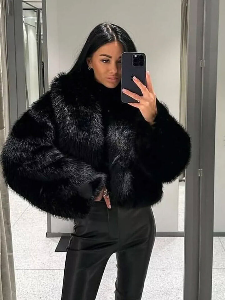 Fashionable women's faux fur jacket, side profile. Wide lapel collar, elegant and cozy for cold weather.
