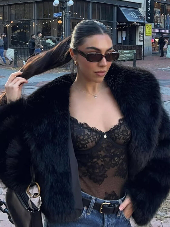 High-quality faux fur women's coat. Elegant wide lapel design for chic & cozy long-sleeve winter outerwear.