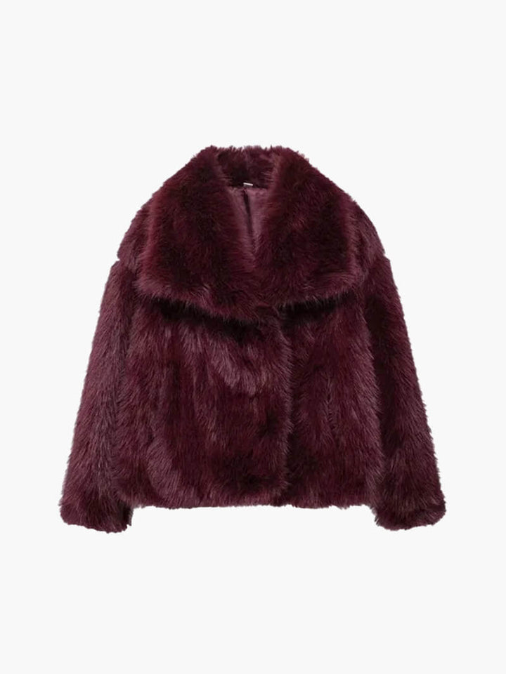 Elegant women's faux fur jacket with wide lapel collar & long sleeves. Classic style for luxurious winter warmth.