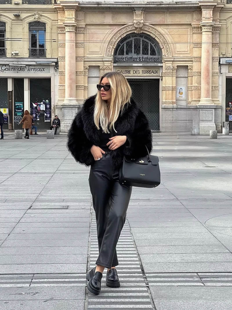 Stylish women wearing a classic faux fur coat with a wide lapel. Chic and elegant winter outerwear.