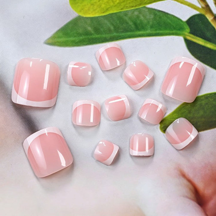 Achieve classic French tip gel nails at home with this women's nail art kit. Perfect for elegant nude pink beauty.
