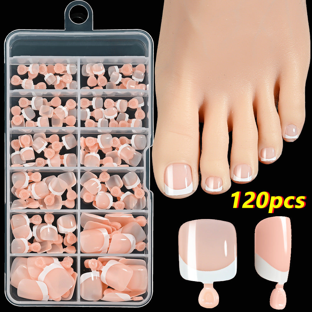 Classic French tip press-on toenails, an elegant and easy nail art set for women's DIY pedicures.