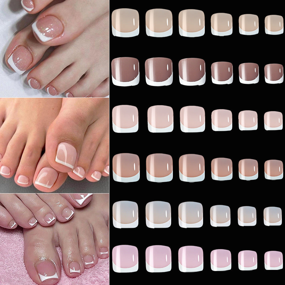 Elegant French tip fake toenails for women, offering a sophisticated nail art design and DIY beauty.