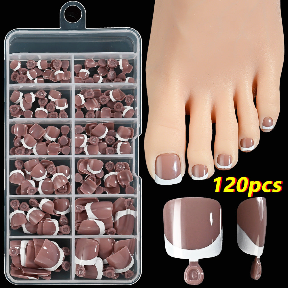 Beautiful French tip toenail art set for women, featuring elegant press-on nails for a quick pedicure.