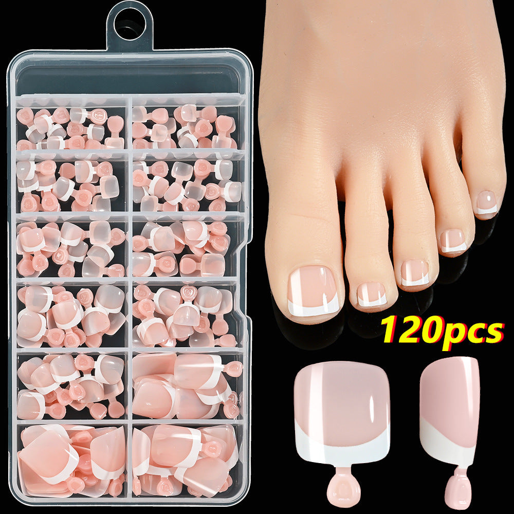 Instant French tip toenails for women, a classic press-on nail art set for elegant pedicures.