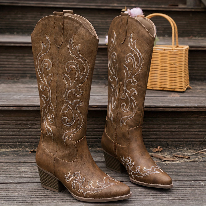 Fashion-forward women's cowboy boots, knee-high western design, intricate embroidery.