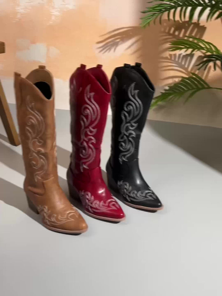 Women's knee-high western boots, perfect for riding, featuring a pointed toe & block heel.