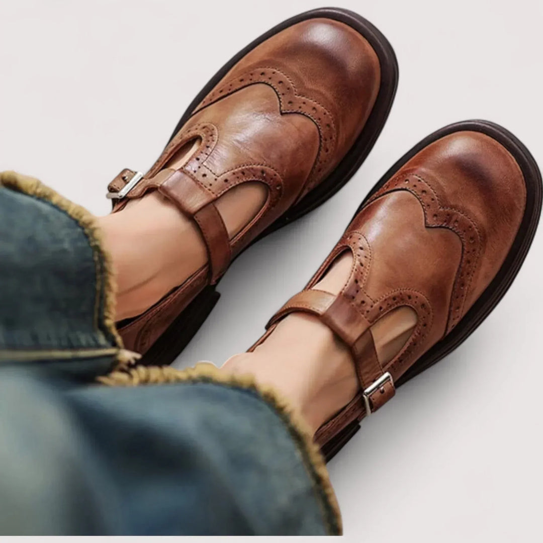 Women's classic Mary Jane shoes with elegant brogue detailing, comfortable round toe flats for vintage-inspired style.