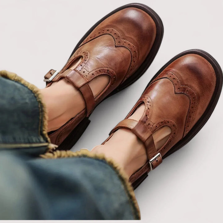 Women's classic Mary Jane shoes with elegant brogue detailing, comfortable round toe flats for vintage-inspired style.