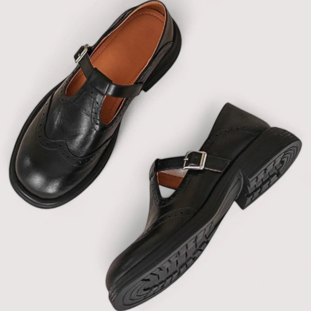 Elegant women's Mary Jane strap shoes with brogue detail, perfect comfortable flats for casual or dress wear.