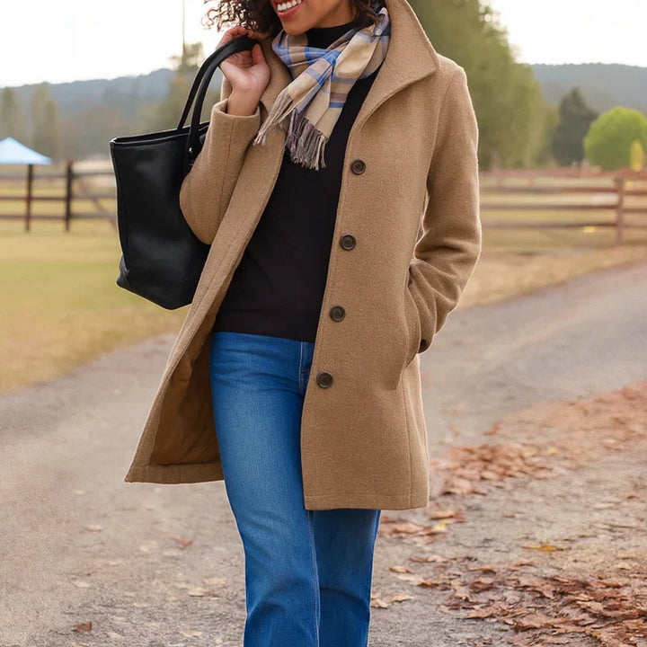 Classic button-front mid-length coat for women, versatile for winter fashion & sophisticated everyday style.