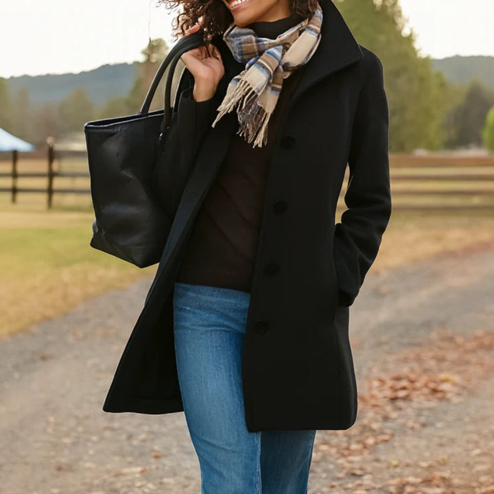 Chic women's button-up mid-length coat, a classic outerwear piece for fall fashion and office wear.