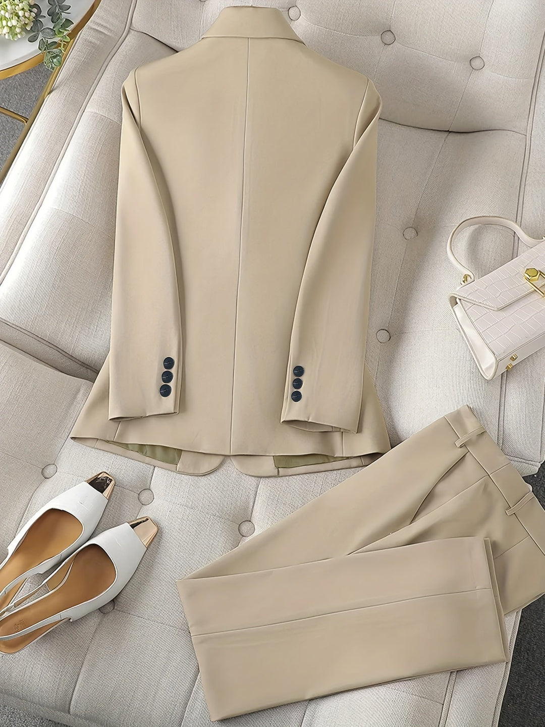 Close-up of women's tailored blazer with classic notched lapel. Essential piece of a professional business attire set.