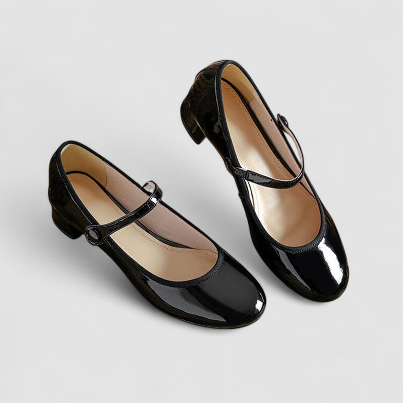 Shiny women's patent Mary Jane heels, featuring a sturdy block heel, rounded toe, and comfortable strap.