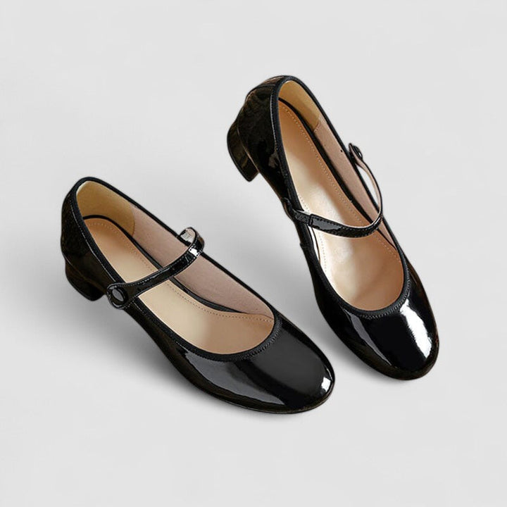 Shiny women's patent Mary Jane heels, featuring a sturdy block heel, rounded toe, and comfortable strap.