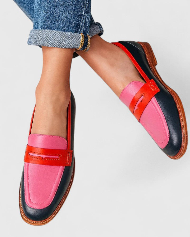 Women's classic pink penny loafers with low heel. Comfortable slip-on round toe shoes for casual or work. Smart casual.