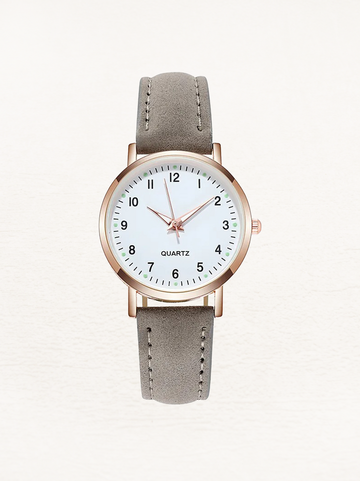 Minimalist women's classic round dial watch, elegant brown leather strap. A timeless everyday timepiece.