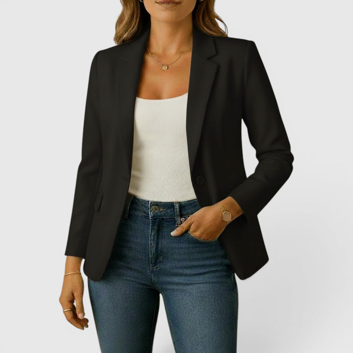 Women's classic stretch blazer featuring front pockets and an elegant two-button closure.