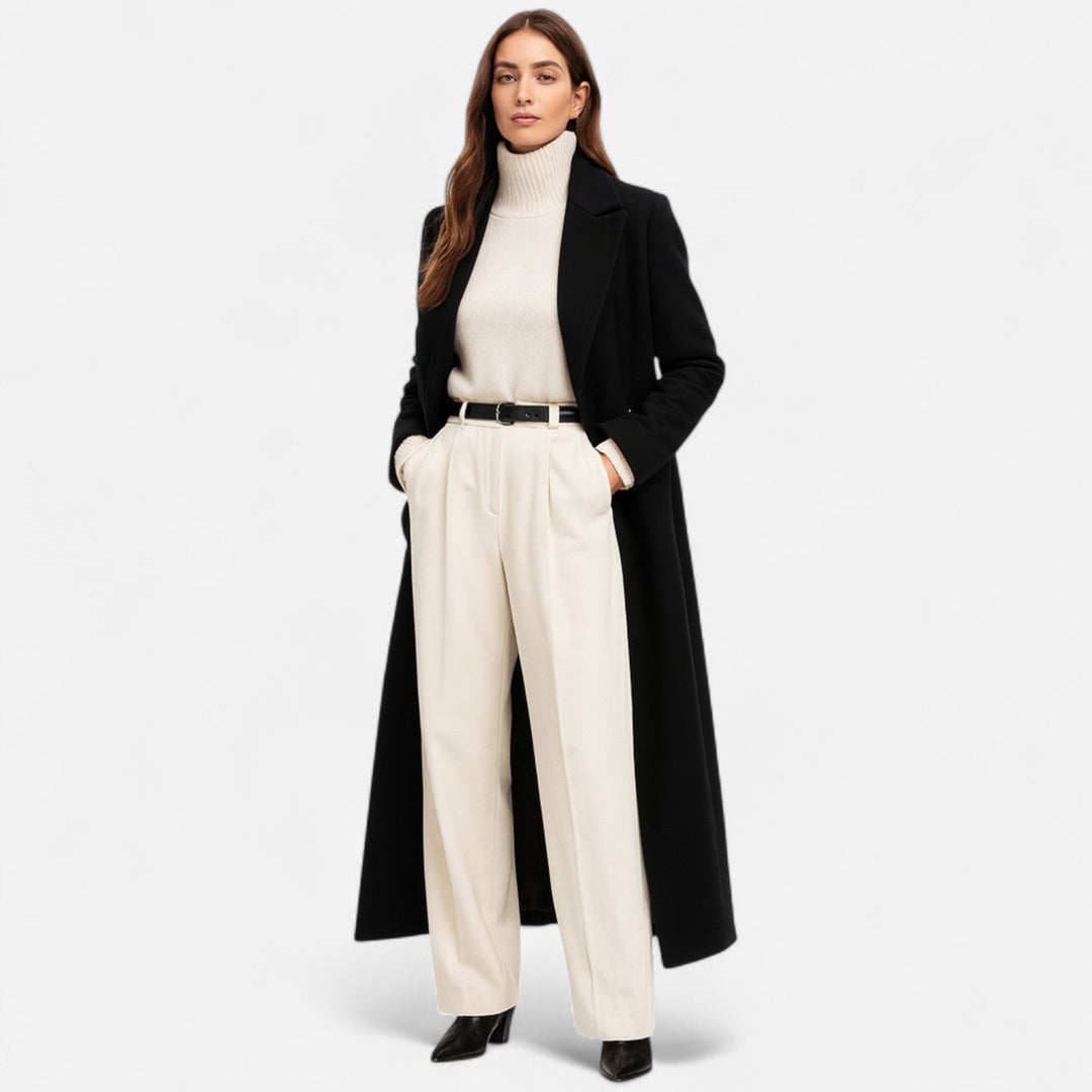 Women's classic tailored black longline coat featuring a stylish notch lapel, perfect for elegant winter outerwear.