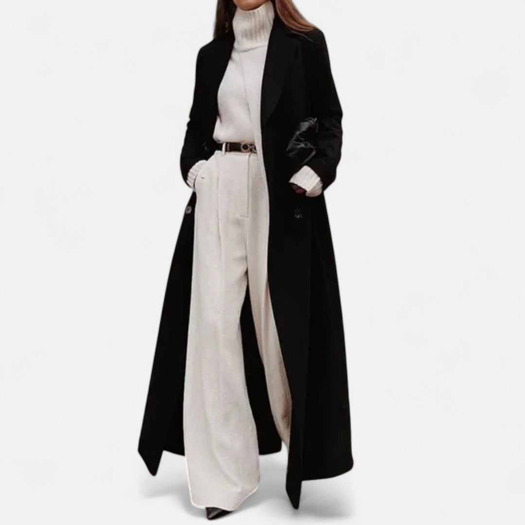 Elegant women's black longline maxi coat with a sophisticated notch lapel and button front, ideal for layered looks.