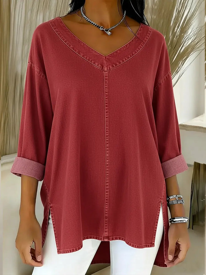 Stylish women's long sleeve V-neck tunic shirt, offering a relaxed fit and versatile fashion for any occasion.