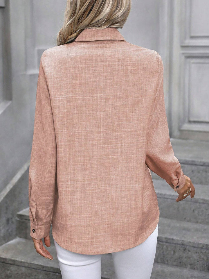 Stylish women's long sleeve collared shirt, button-front design for smart casual appeal.