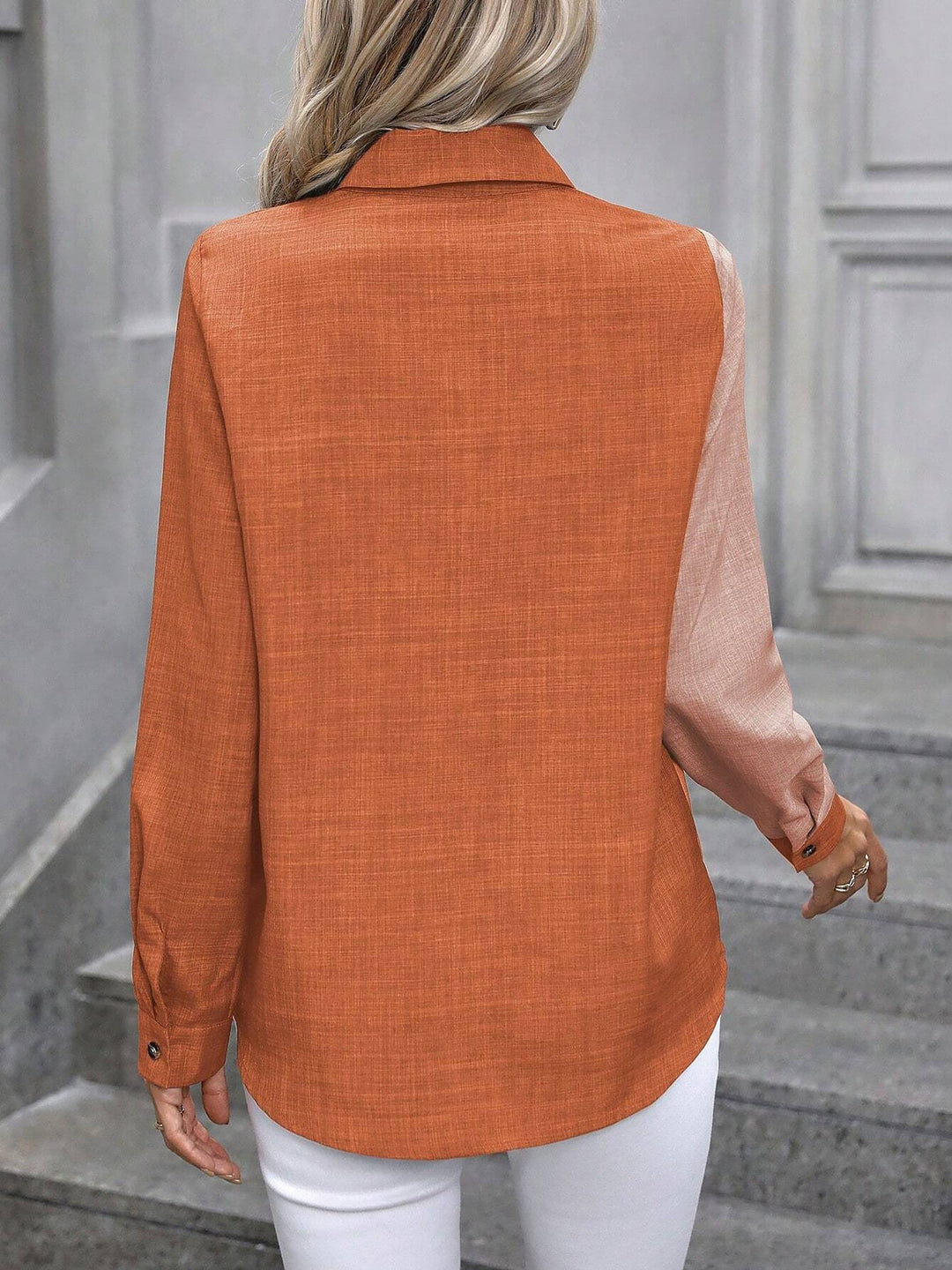 Versatile women's button-front collared shirt, long sleeves, for smart casual outfits.