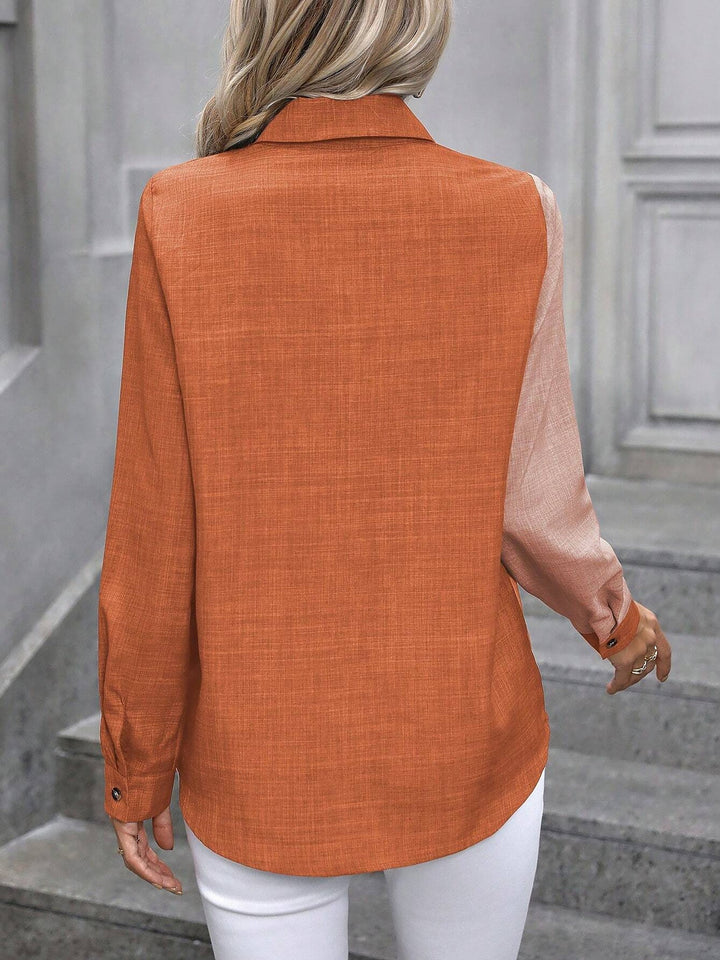 Versatile women's button-front collared shirt, long sleeves, for smart casual outfits.