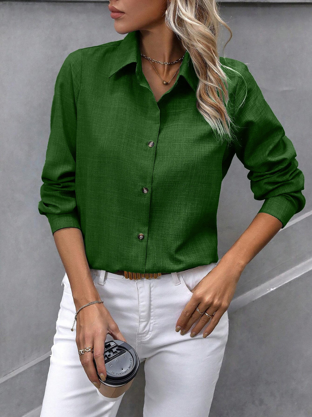 Women's classic white long sleeve button-up shirt, offering a refined and smart look.