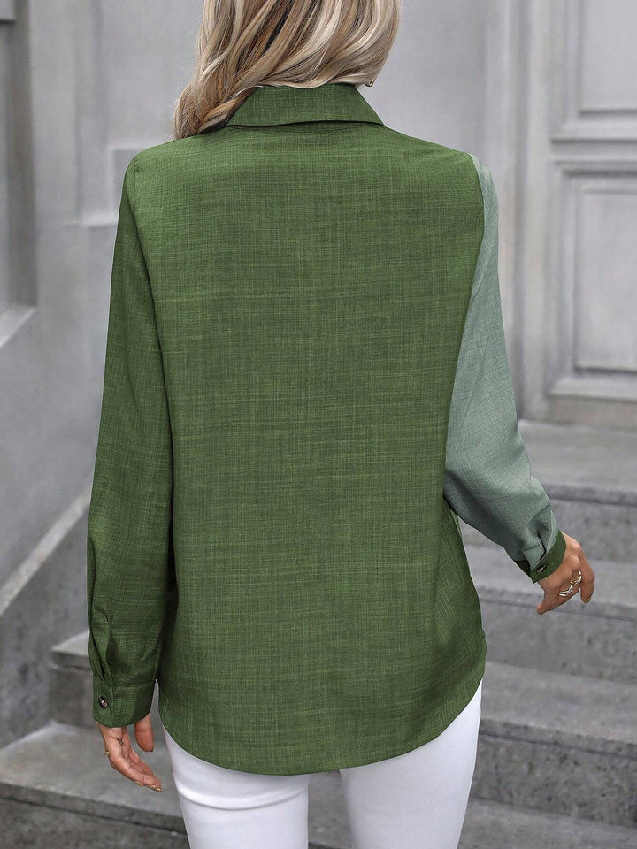 Women's professional long sleeve button-up shirt, tailored fit for a sharp office look.