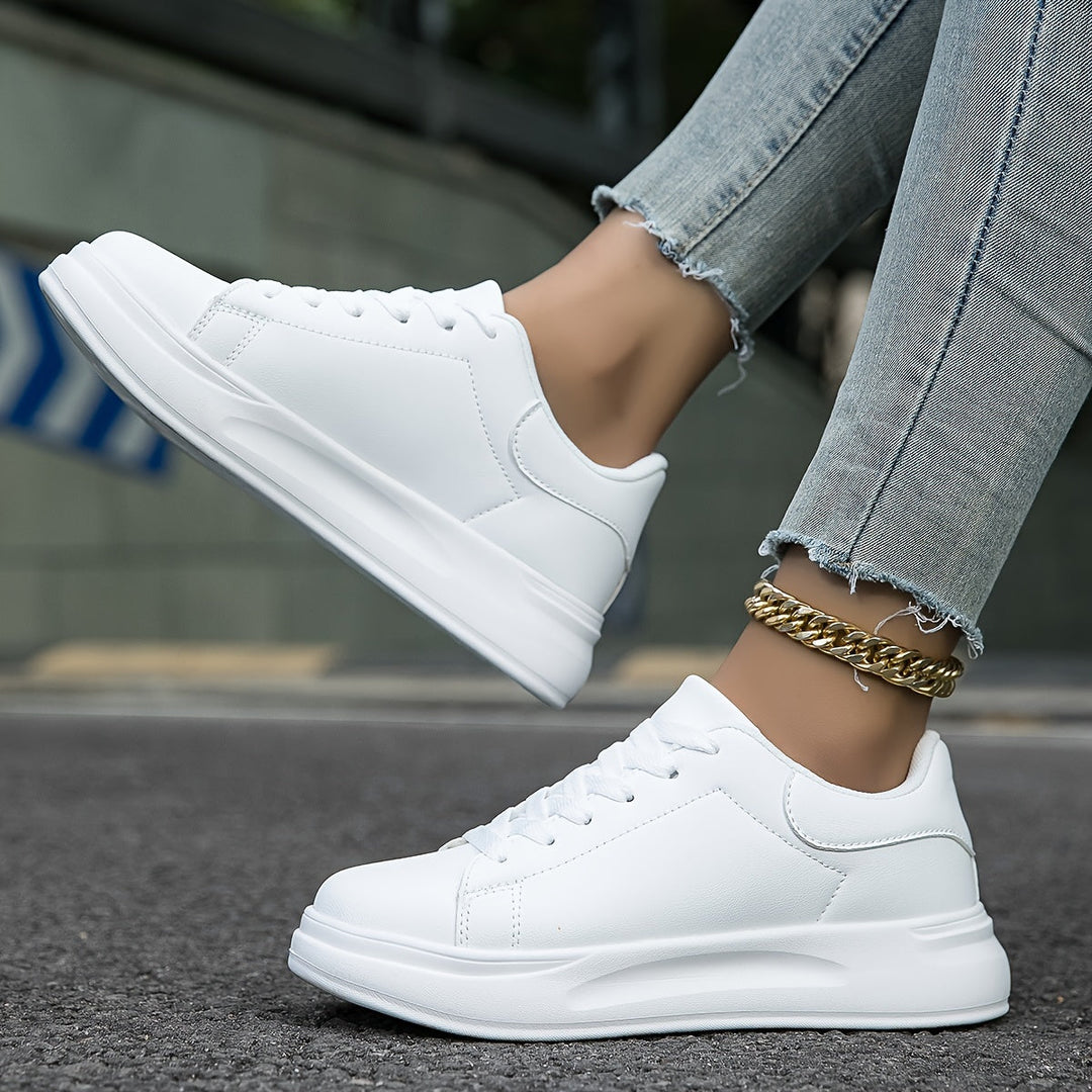Fresh white women's fashion sneakers, blending minimalist design with superior comfort for casual wear.