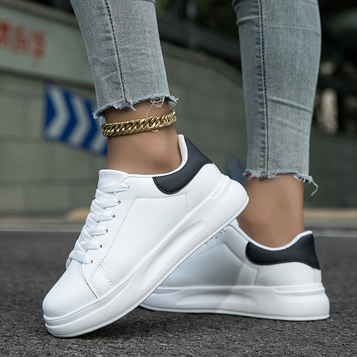 Comfortable women's white footwear with a clean, versatile design, ideal for daily casual wear.