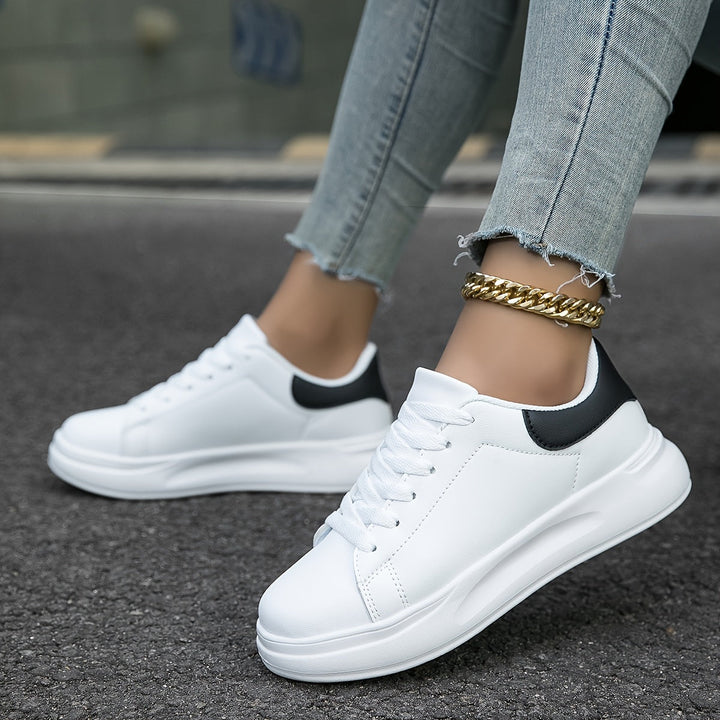 Crisp white fashion sneakers for women, providing effortless style and ultimate comfort for everyday use.