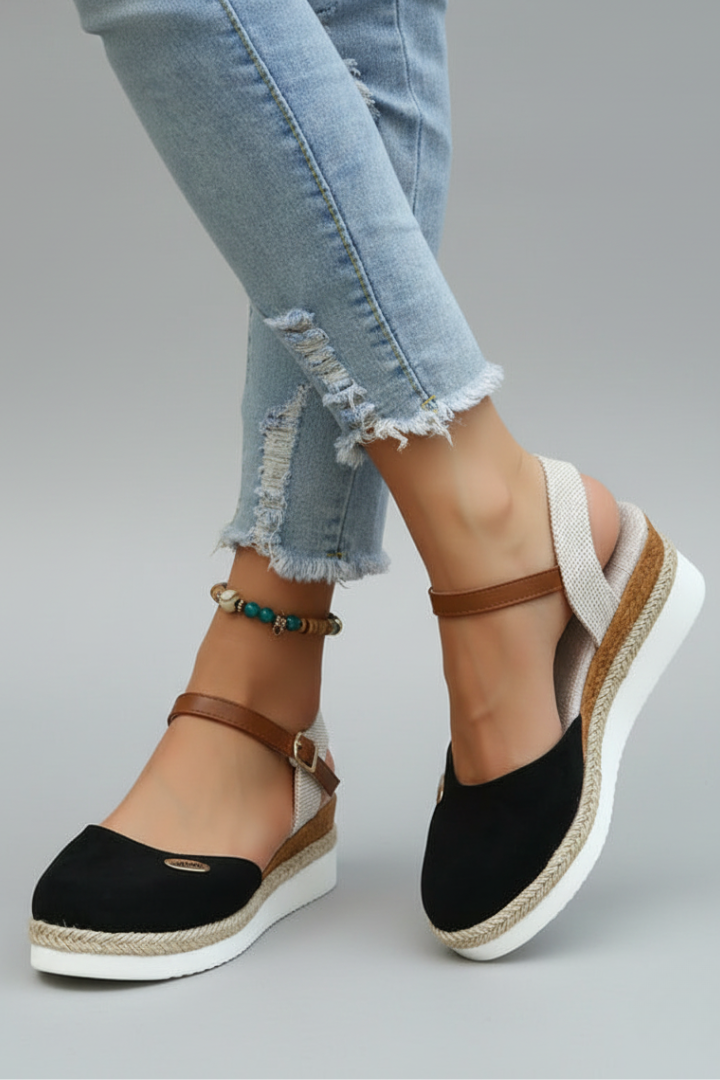 Stylish women's closed-toe espadrille sandals featuring a comfortable slingback strap; great for warm weather.