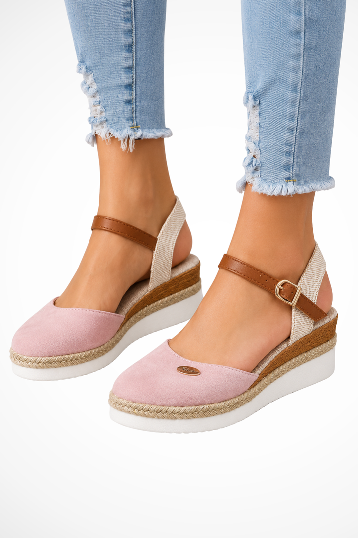 Comfortable women's closed toe espadrille wedges featuring a stylish ankle strap, ideal for spring elegance.