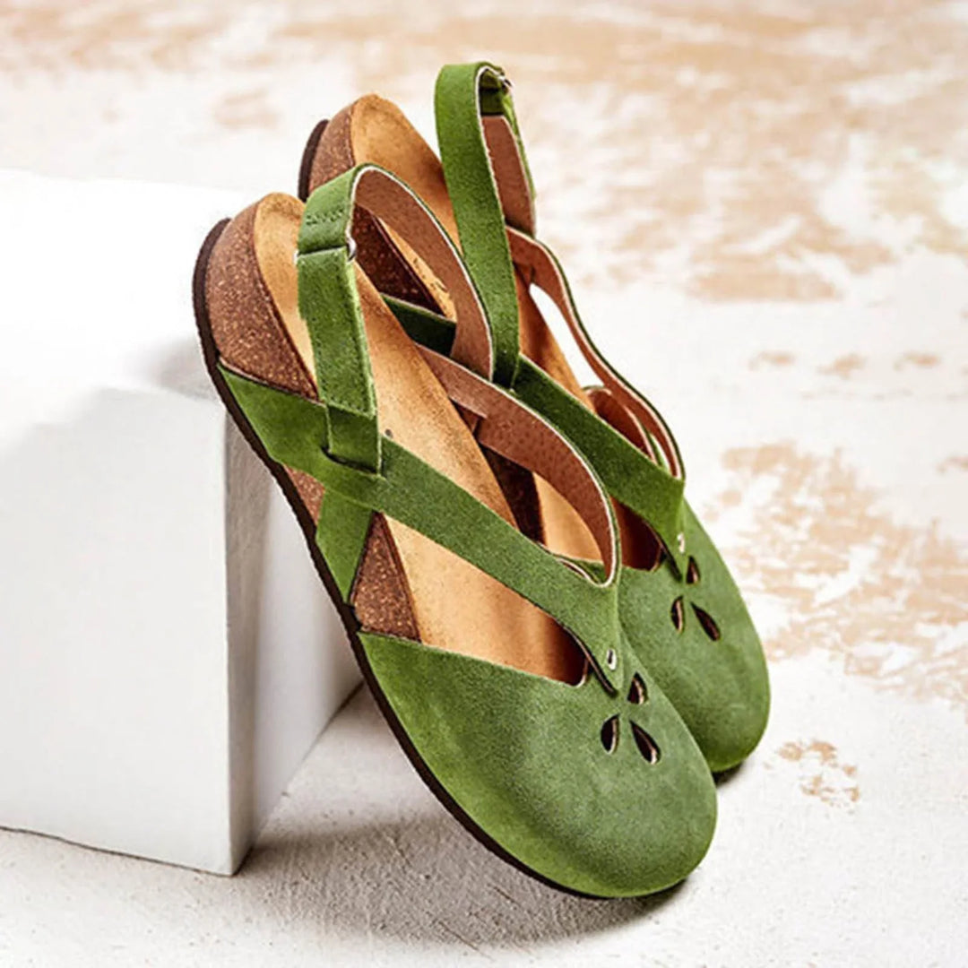 Women's closed-toe slingback sandals with elegant floral cut-outs, perfect for summer casual & dressy wear.