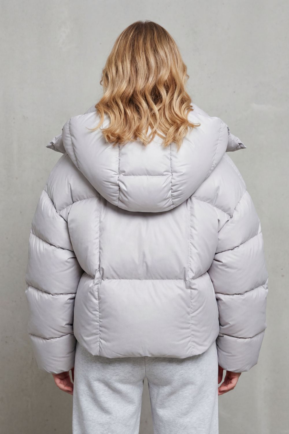 Stylish charcoal women's cropped puffer jacket, cloud soft and lightweight, perfect for winter fashion & casual wear.