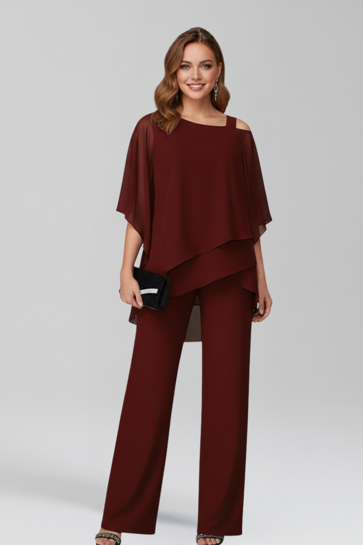 Modern women's cold-shoulder wide-leg jumpsuit in flowing fabric, a chic and fashionable choice.
