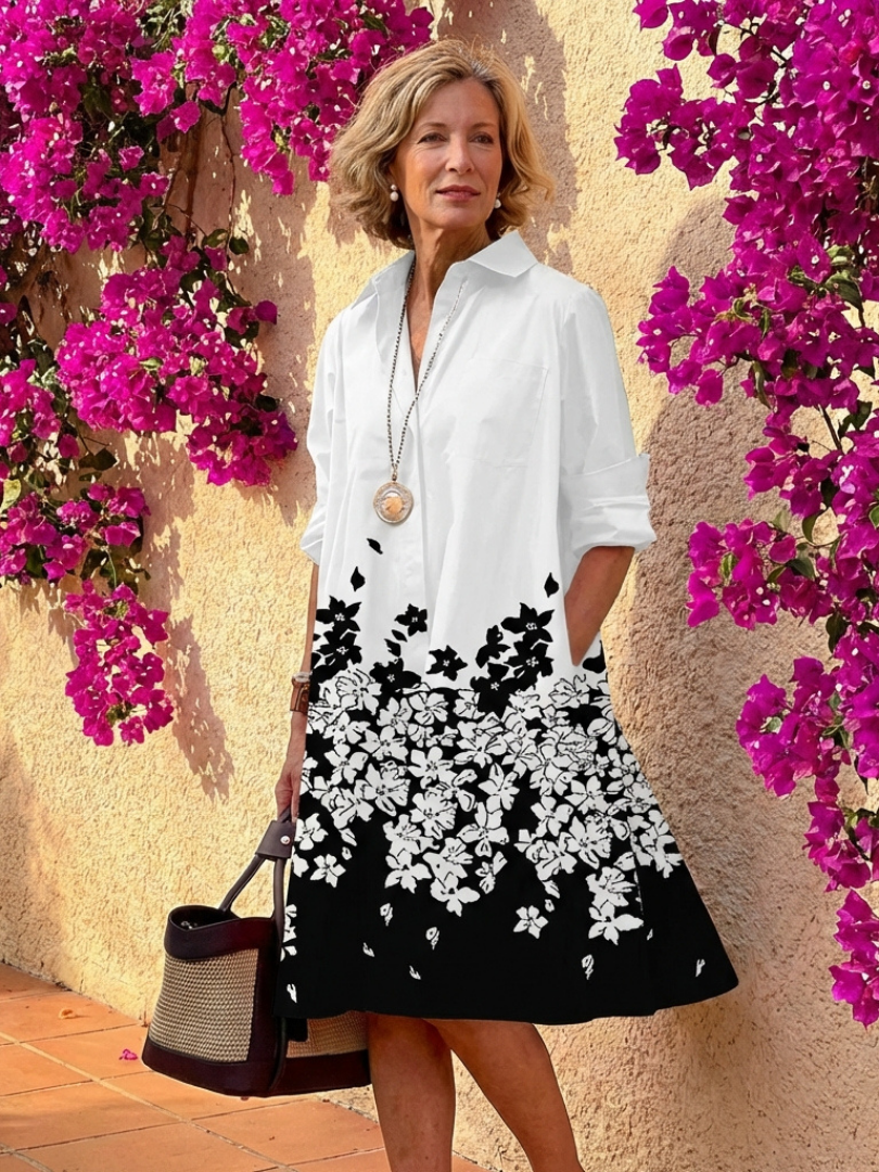 Women's collared midi day dress with full button closure. A comfortable and versatile piece for everyday elegance.