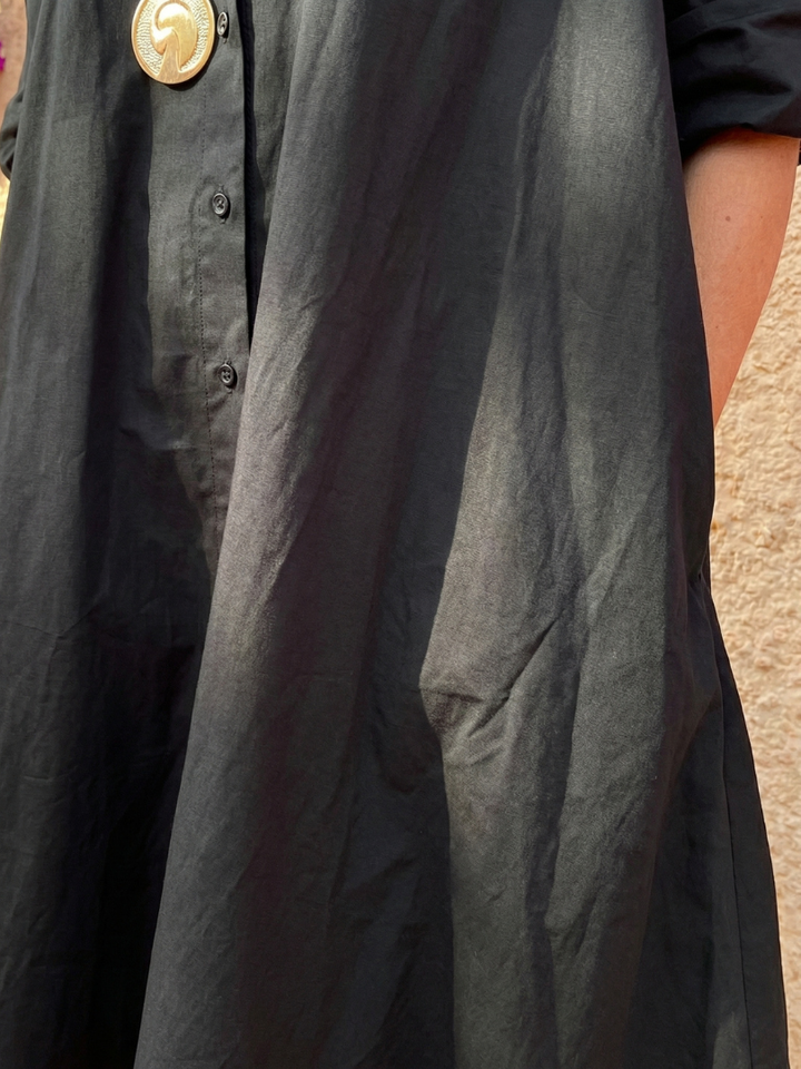 Comfortable women's collared midi dress with full button front. Elegant design for versatile day-to-night wear.