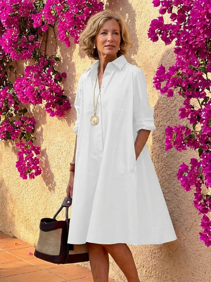 Chic women's collared button-front midi dress. A stylish and comfortable relaxed-fit long-sleeve design.