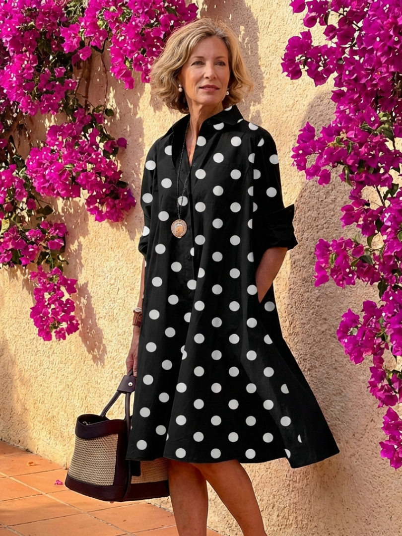 Elegant women's collared button-front midi dress in a relaxed fit. Ideal for sophisticated casual spring/summer looks.