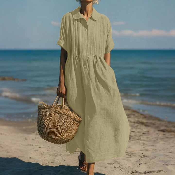 Women's elegant loose collared buttoned pleated maxi dress, a versatile and comfortable design.