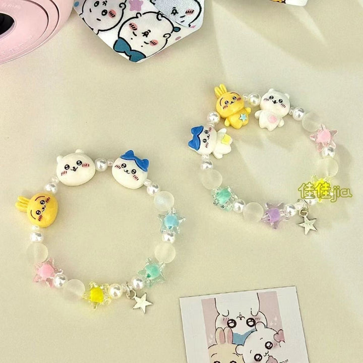 Colorful women's animal charm bracelet with various cute animal figures & beaded details. Playful fashion jewelry.