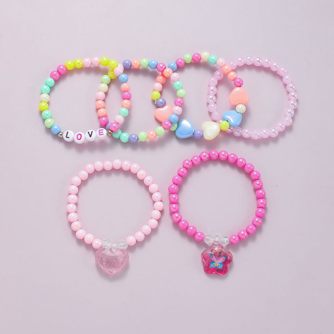 Multi-color women's stretch bracelet set with assorted beads & charming accents.