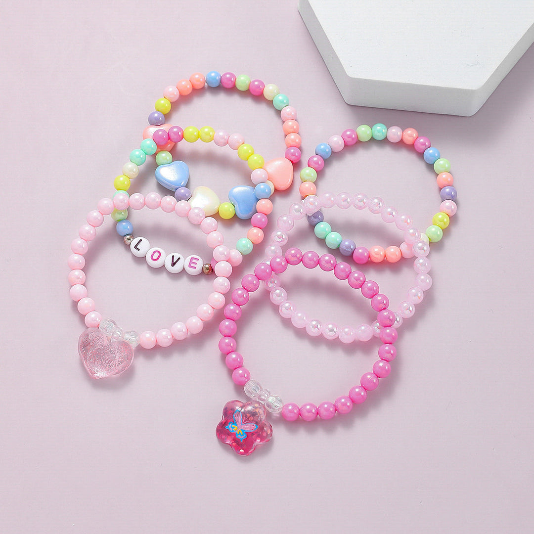 Assorted colorful beaded charm bracelets in a set for women, stackable style.