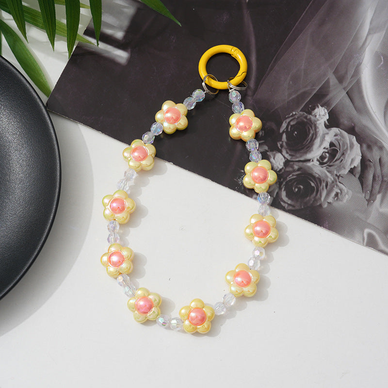 Fashionable floral beaded phone chain for women, a secure and beautiful smartphone lanyard.