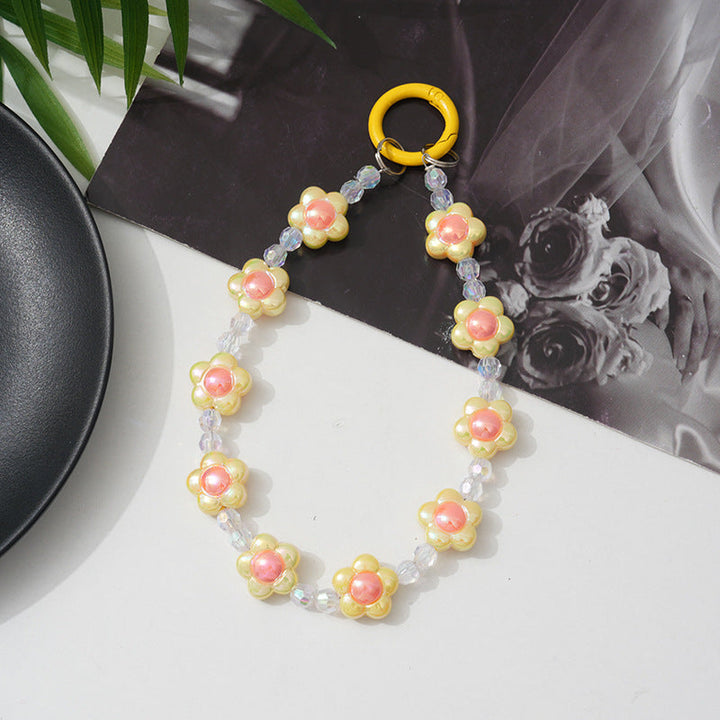 Fashionable floral beaded phone chain for women, a secure and beautiful smartphone lanyard.