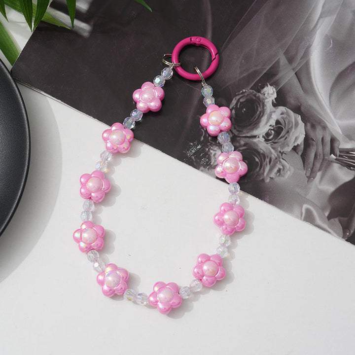 Beaded floral phone chain, a stylish and secure lanyard for women's smartphones, fashion accessory.