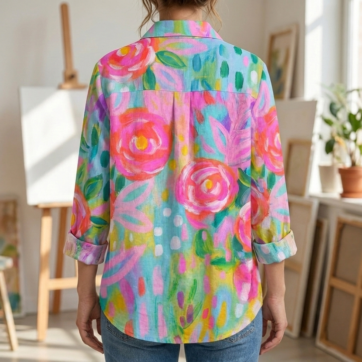 Vibrant floral button-front women's blouse. Relaxed fit, long sleeve shirt, ideal for smart casual spring & summer fashion.